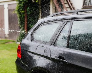 spraying water onto the car